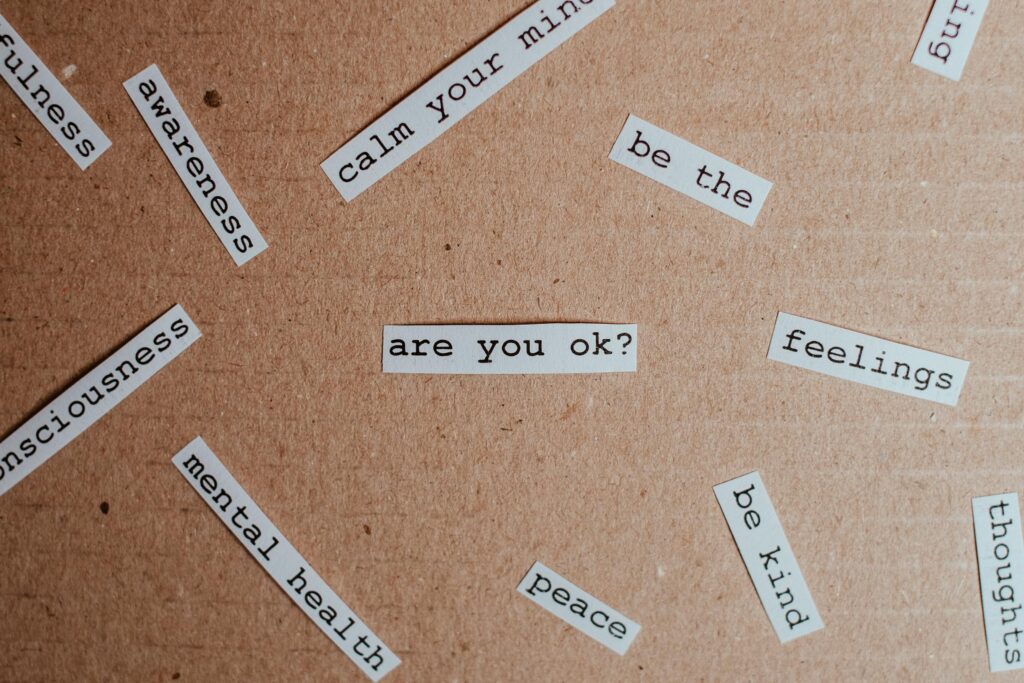 List of feelings pdf - Cut-out words promoting feelings, mental health awareness on cardboard background.